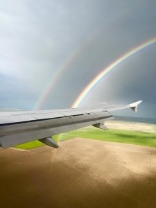 rainbow on airplane wing